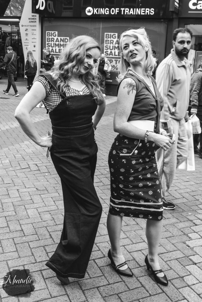 Girls being silly to whilst leafleting.